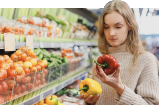 person looking at peppers